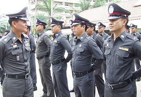 Lt. Gen. Wibun Bangthamai (left) inspects the force at the Chonburi Immigration office in Jomtien.